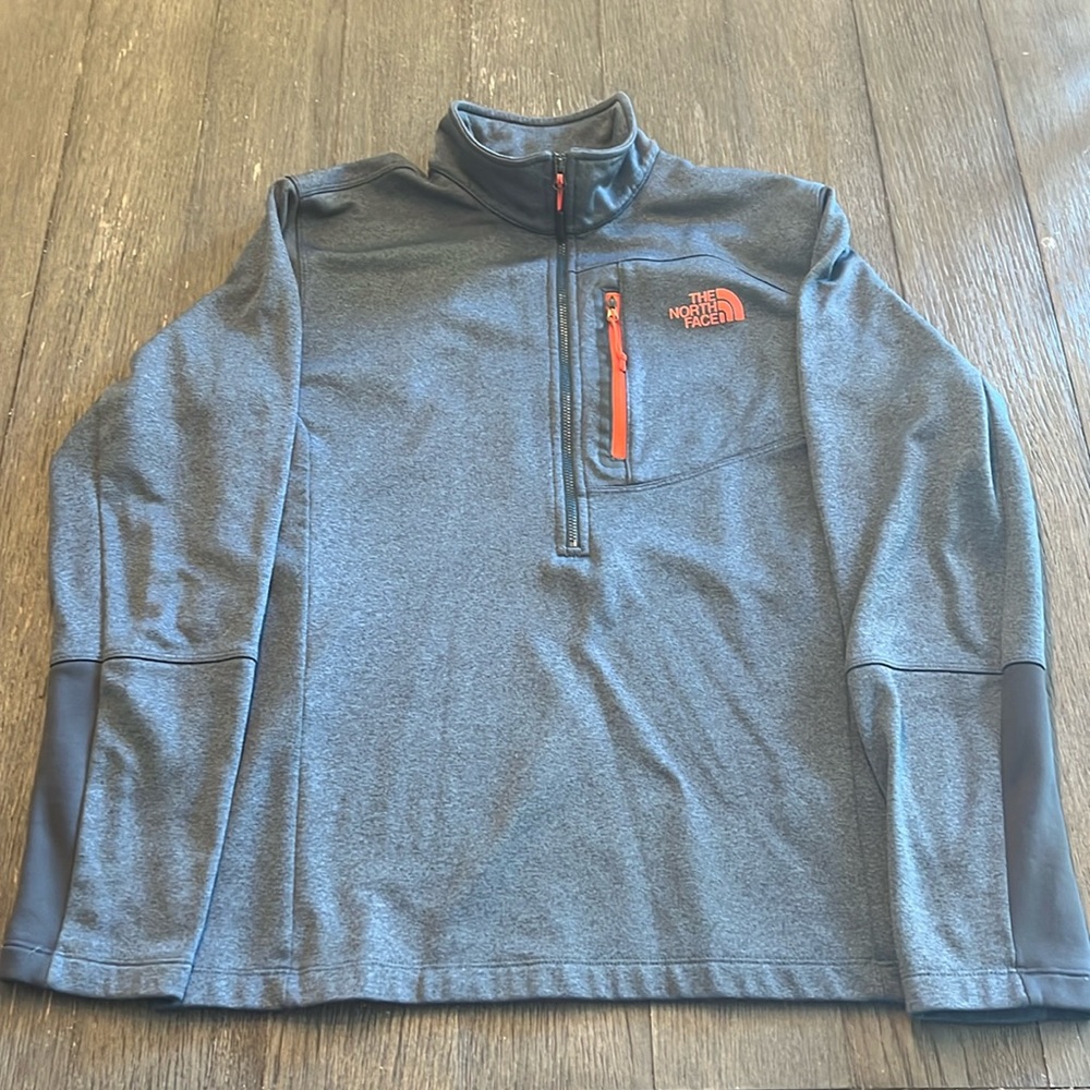 The North Face Heathered blue with dark orange logo and chest zipper